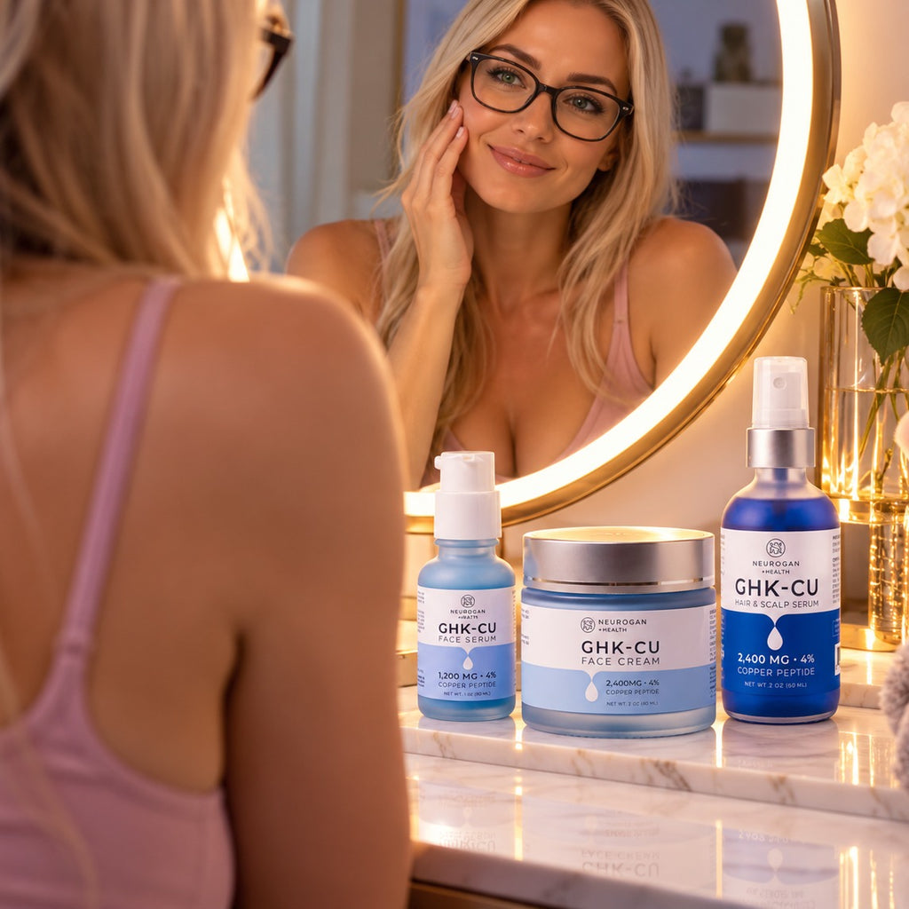Sarah at a vanity with the Neurogan GHK-Cu Skin & Hair Stack including face serum, face cream, and hair and scalp serum